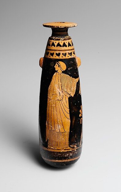 Attic red-figure alabastron depicting a winged Nike (Victory) in flowing drapery, Greek, ca. 480 BCE.